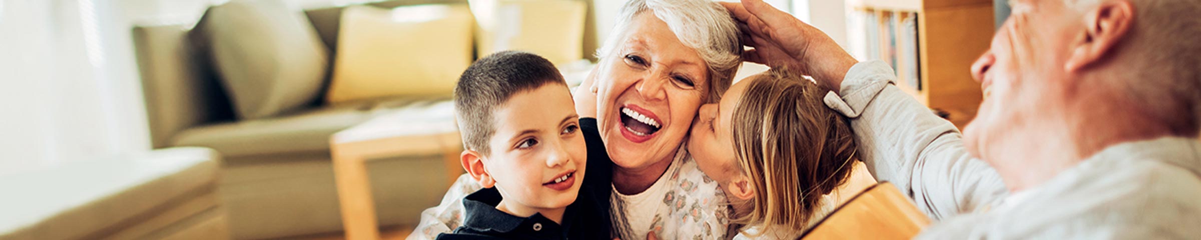 Grandparents having fun at home with their grandchildren