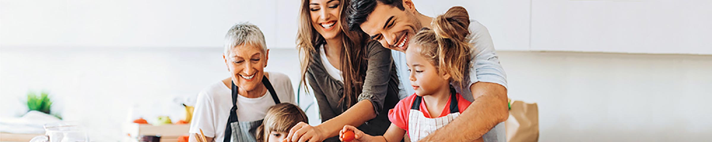 Multi-generational family working together in the kitchen