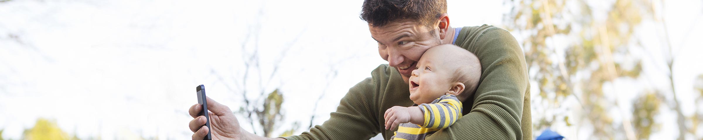 Father holding a baby in his lap