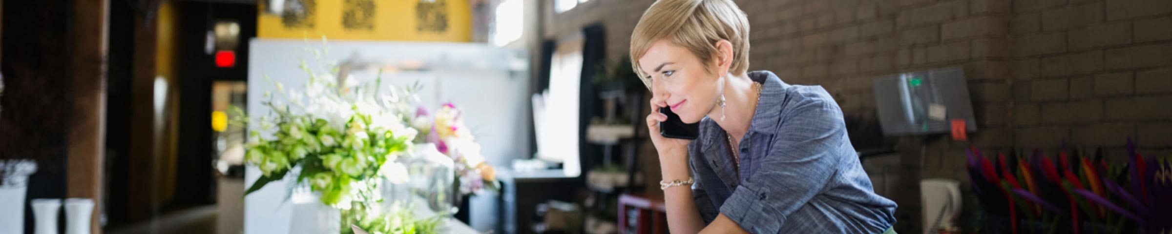 Female entrepreneur reviewing plans at her store