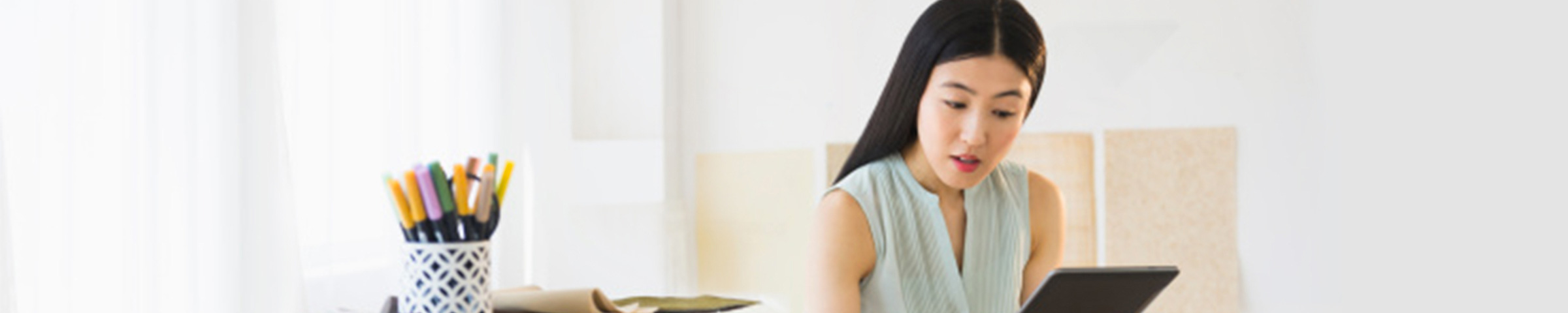 Woman reading a report at an office