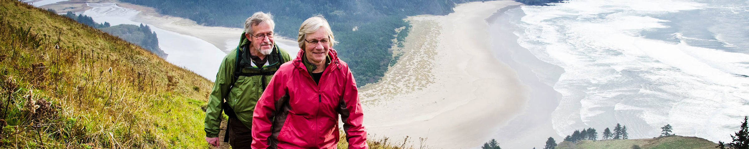 Retired couple hiking in the mountains