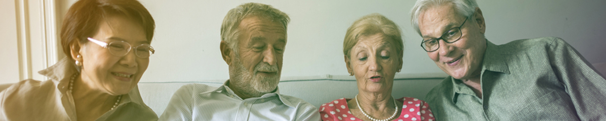 Older family members reviewing an estate plan on a computer