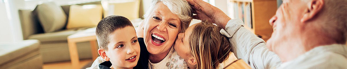 Retired couple spending time with their grandchildren